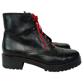 Bottes de combat à lacets cloutées Valentino Garavani en cuir noir Noir