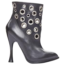 Alexander Mcqueen-Alexander McQueen grommet studded spool pirate ankle boots-Black