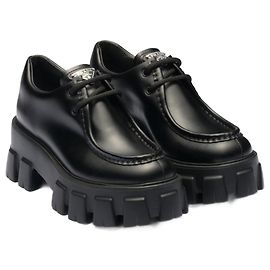 Prada Stringate Monolith in pelle spazzolata Nero