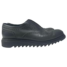 Salvatore Ferragamo- Salvatore Ferragamo Lasercut Slip-On Brogues in Black Leather-Black