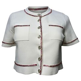 Sandro Paris verziertes Strick-Button-Down-Crop-Top aus weißer Viskose. Weiß