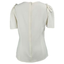 Dolce & Gabbana Oberteil in Creme mit Schulterruffles Weiß Roh