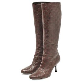 Botas de cuero burdeos con logo monograma GG Guccissima de Gucci Coñac