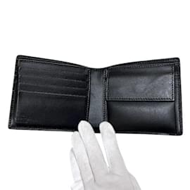 Gucci-Carteira bi-fold em couro preto com estampa GG da Gucci-Preto