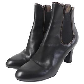 Botas de cuero con gomas Louis Vuitton Monogram Negro