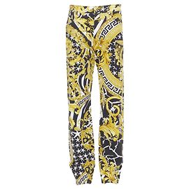 Jeans Medusa stud Barocco selvaggio di Versace D'oro Metallico