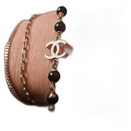 Chanel-Gold Chanel bracelet with black beads-Golden