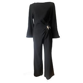 Tuta nera Thierry Mugler con spilla a stella Nero
