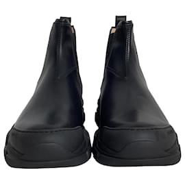 Gucci-Botas Chelsea de couro preto com sola lug e logo Leon da Gucci-Preto
