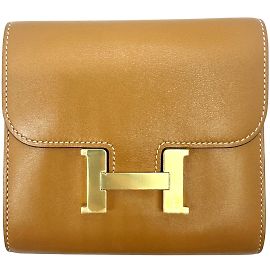 Monedero compacto Constance de Hermès Dorado