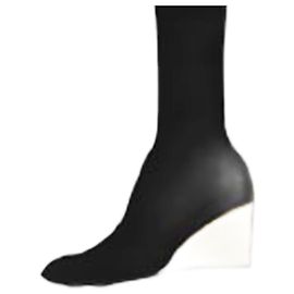 Paco Rabanne Botas pretas curtas com base dourada Preto