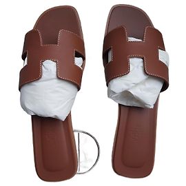 Hermès Orã Marrom