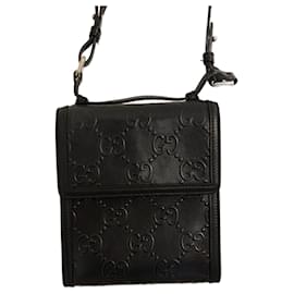 Gucci-Black Gucci GG embossed crossbody bag-Black