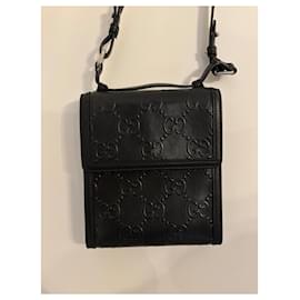 Gucci-Black Gucci GG embossed crossbody bag-Black