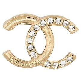 Broche Chanel em metal dourado champanhe e strass Dourado