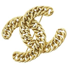 Chanel Brosche mit vergoldeter Kette und COCO-Logo Golden
