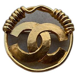 Broche Chanel dorée en métal Doré