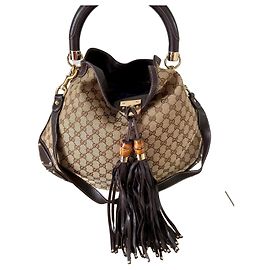 Bolsa Gucci GG Monogram Indy Bege Bege