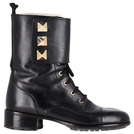 Valentino Garavani Bottes de combat à lacets Valentino Rockstud en cuir noir Noir