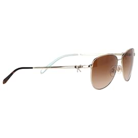 Tiffany & Co-Lunettes de soleil aviateur Bow de Tiffany & Co. en métal doré-Doré