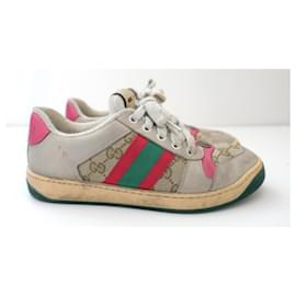 Gucci-Coolest Gucci Screener vintage look trainers. Worn a handful of times and come with box, dustbags and info cards. Made from signature monogram canvas with red and green webbing and red leather trims. Have a coupe of marks form wear but these are supposed to look vintage. Size 36.5. Measures approx - 10” heel to toe.-Beige