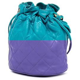 Chanel-Sac seau à cordon en cuir d'agneau matelassé bleu Chanel avec pompon-Bleu,Turquoise
