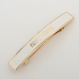 Fermaglio Miu Miu oro e bianco Bianco D'oro