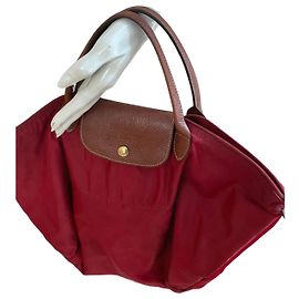 Borsa Longchamp rossa con dettagli in pelle marrone Bordò