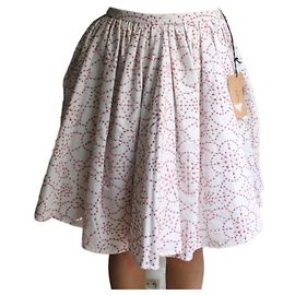 Falda acampanada Alaïa de algodón bordado blanco flores rosas Blanco