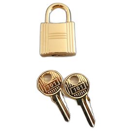 Cadeado Hermès para bolsas Hermès Kelly e Birkin, aço dourado com 2 chaves Gold hardware