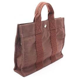 Hermès-Sac tote en toile nylon Hermès Herline PM-Marron