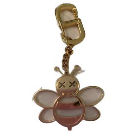 Chaveiro icônico de abelha x Kaws Christian Dior Dourado