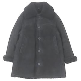 Fendi-Manteau en shearling Fendi en cuir de mouton avec bouton logo-Noir,Jaune