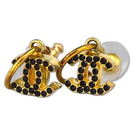 Orecchini Chanel CC dorati con pietra nera Nero D'oro