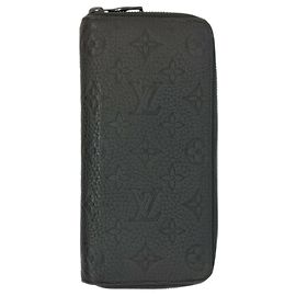 Cartera Zippy Vertical Redonda Louis Vuitton M69047 Negro
