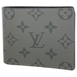 Cartera Slender Monogram Eclipse Reverse de Louis Vuitton Castaño
