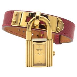 Relógio Hermès Kelly banhado a ouro com pulseira de couro vermelho Dourado