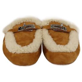 Mules Oz em shearling natural da Hermès Outro