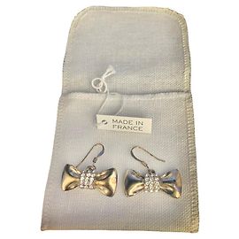 Orecchini a nodo Chloé ottone dorato e strass Gold hardware