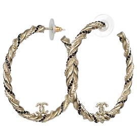 Pendientes de aro retorcido en metal dorado con strass CC de Chanel Plata Dorado