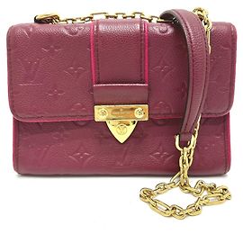 Borsa a catena Saint-Sulpice PM in Monogram Empreinte Louis Vuitton Rosso