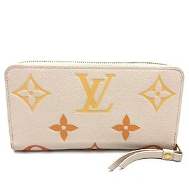 Cartera Zippy Monogram Empreinte Louis Vuitton Beige