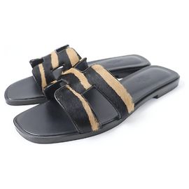 Sandales en cuir Harako Oran d'Hermès Noir Autre