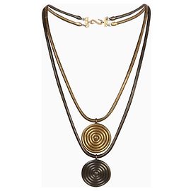Collier Yves Saint Laurent, modèle Africa. Doré