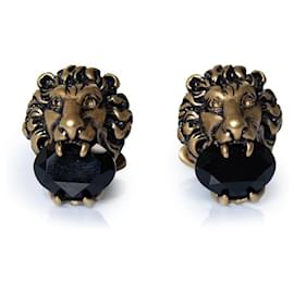 Gemelos Gucci con cabeza de león y piedra negra Negro Dorado