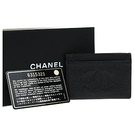 Tarjetero Chanel CC Flap Camelia Caviar Negro