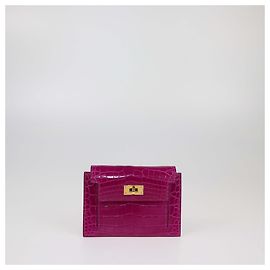 Cartera compacta Kelly de cocodrilo Rose Scheherazade de Hermès Otro