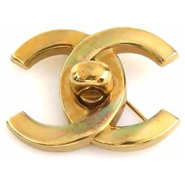 Broche en métal doré Chanel Coco Mark Doré