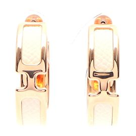 Hermès Brincos Oran Creole em couro dourado Hermes Dourado Metálico