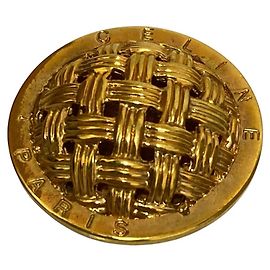 Céline Broche en maille avec logo circulaire Celine Doré Métallisé